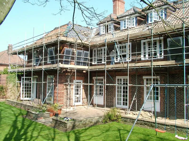 a large brick building with scaffolding around it